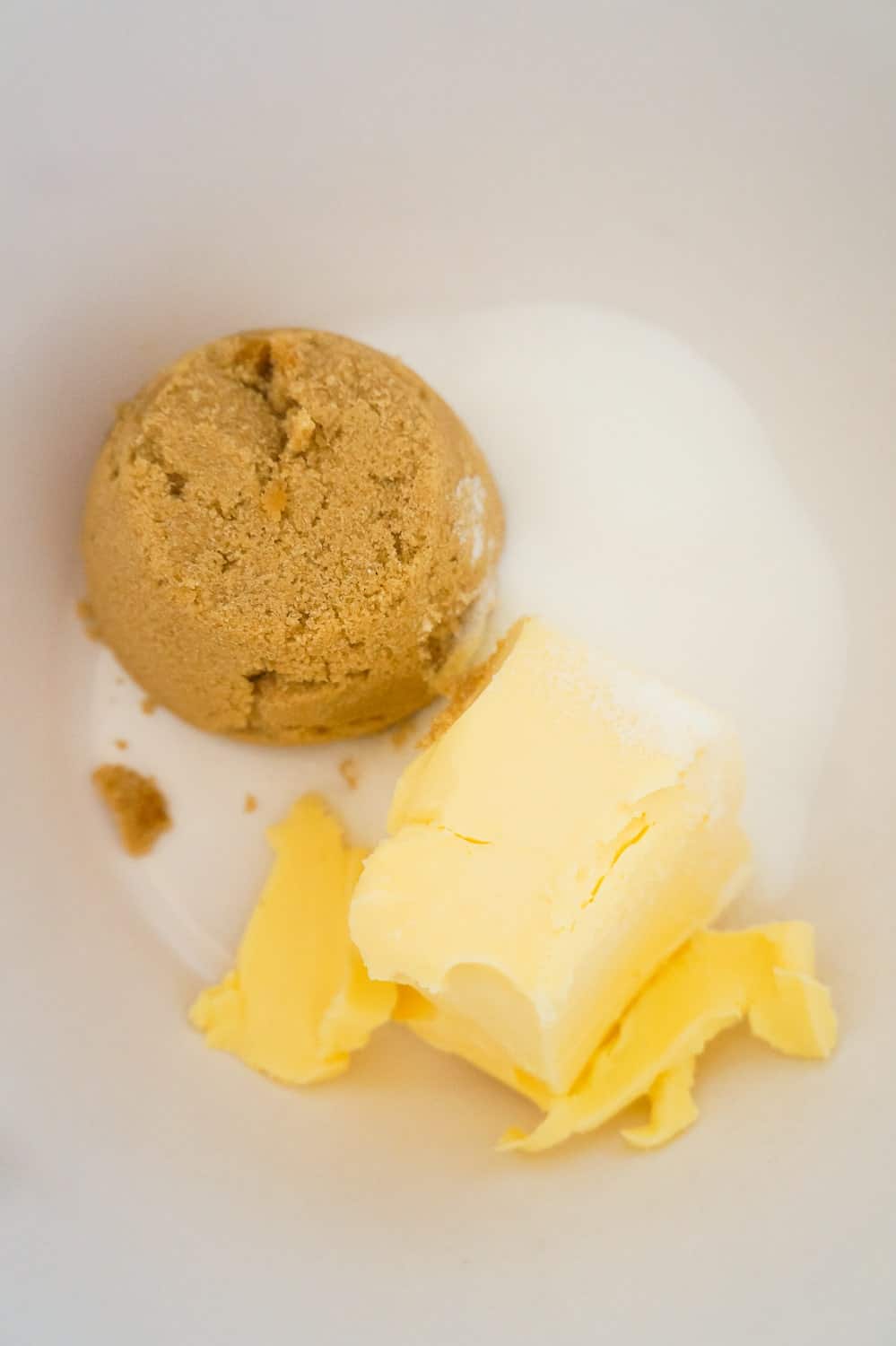 butter flavoured Crisco, brown sugar and granulated sugar in a mixing bowl