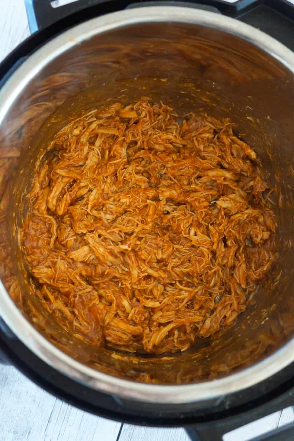 Instant Pot Honey BBQ Chicken Sandwiches are an easy and delicious dinner perfect for weeknights. These shredded chicken sandwiches with honey BBQ sauce are topped with coleslaw and French's fried onions.