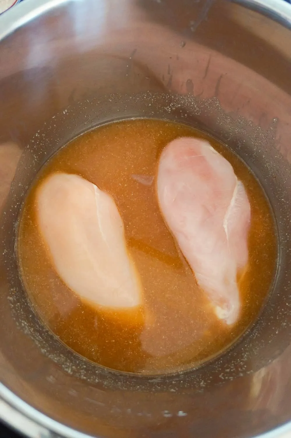 boneless, skinless chicken breasts in liquid in an Instant Pot 