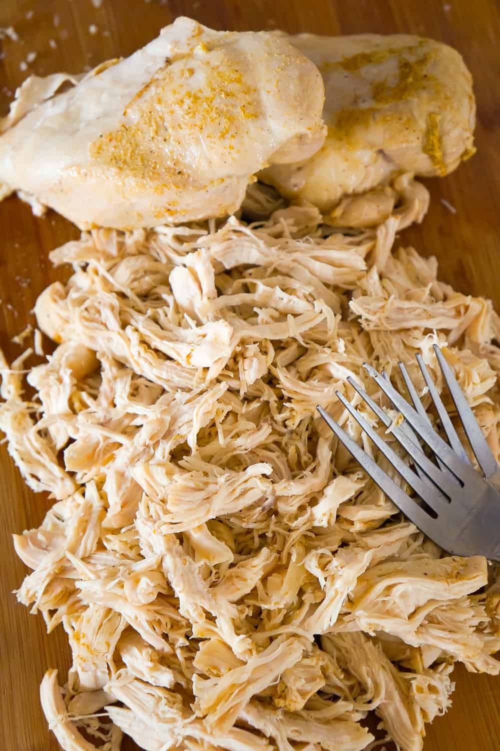 Instant Pot Shredded Chicken Breasts are perfect for using in casseroles, sandwiches, pasta dishes and more. This easy recipe produces about 6 cups of tender and delicious shredded chicken that can be used in any recipe calling for cooked and shredded chicken. Instant Pot shredded chicken can be cooked in advanced and used in multiple dinner recipes throughout the week instead of using store bought rotisserie chicken.