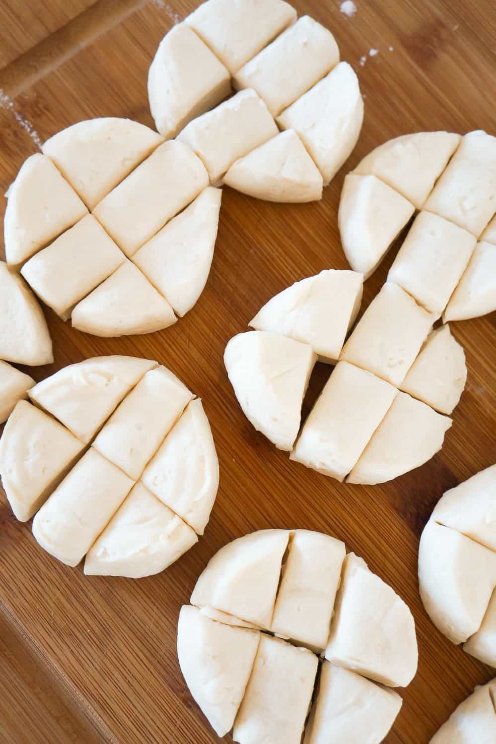 cut up Pillsbury biscuits on a cutting board