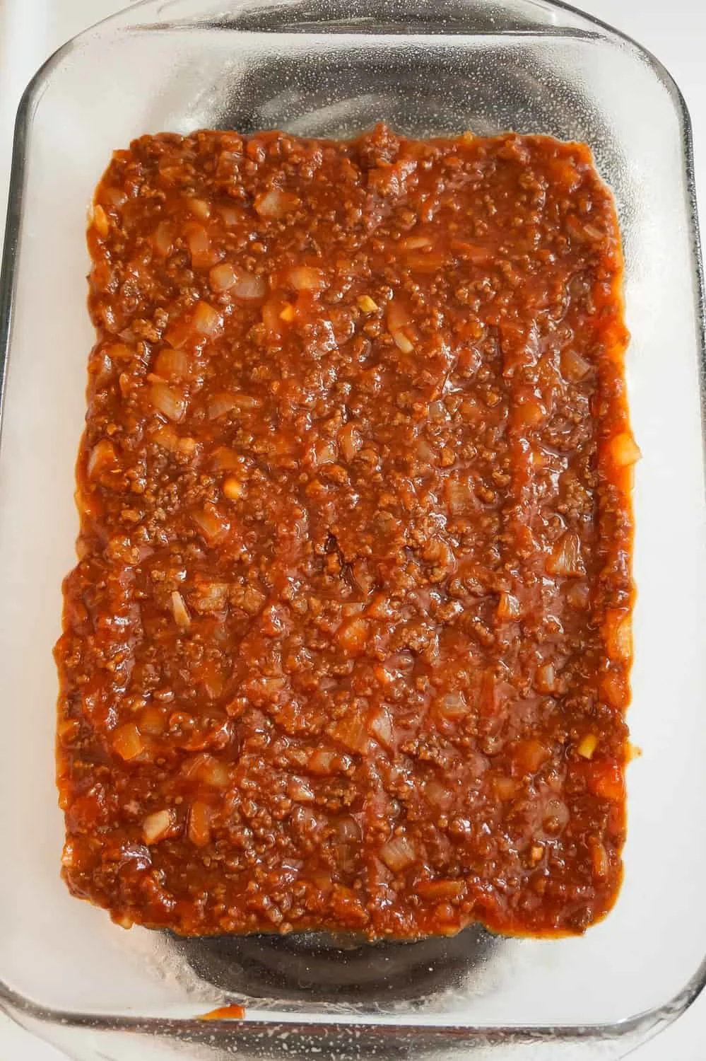 sloppy joe mixture in the bottom of a baking dish