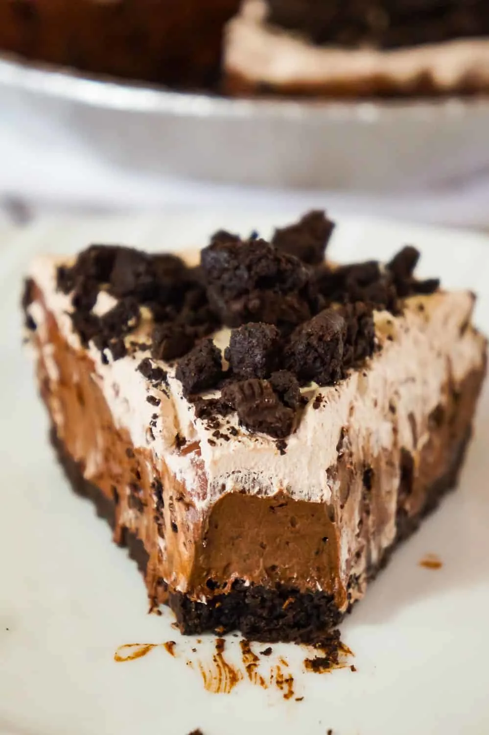 Chocolate Oreo Pie is an easy no bake dessert recipe perfect for when you don't feel like turning on the oven. This decadent pie is made with chocolate instant pudding mix and loaded with Dark Chocolate Oreo cookies.