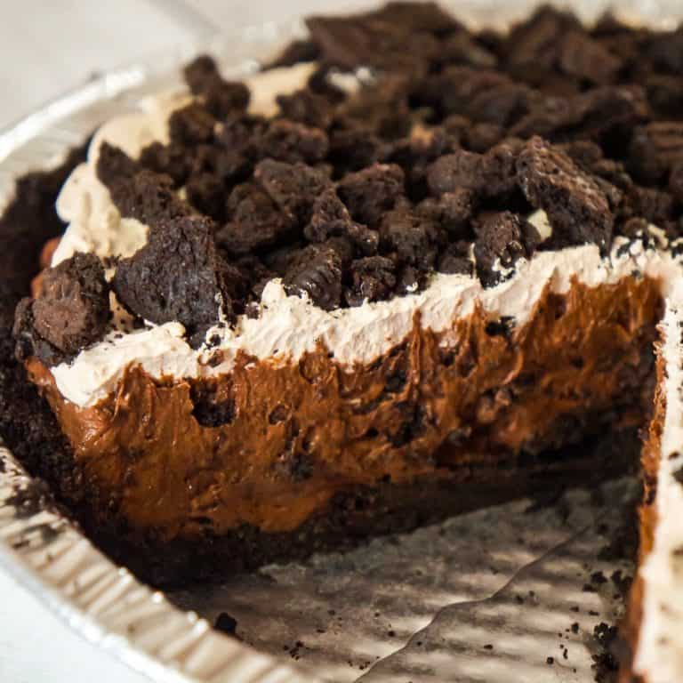 Chocolate Oreo Pie is an easy no bake dessert recipe perfect for when you don't feel like turning on the oven. This decadent pie is made with chocolate instant pudding mix and loaded with Dark Chocolate Oreo cookies.