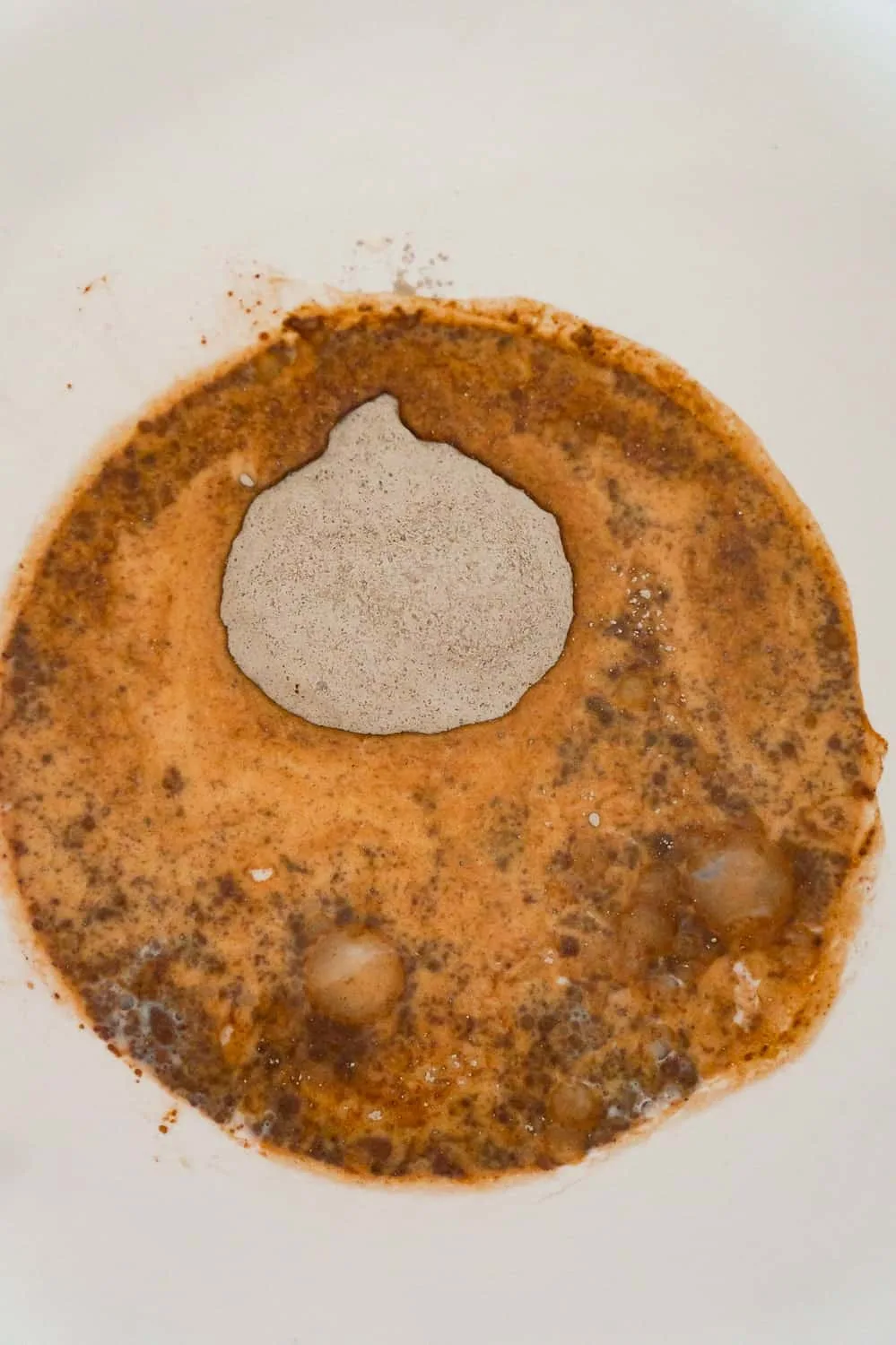 chocolate pudding mix and milk in a mixing bowl