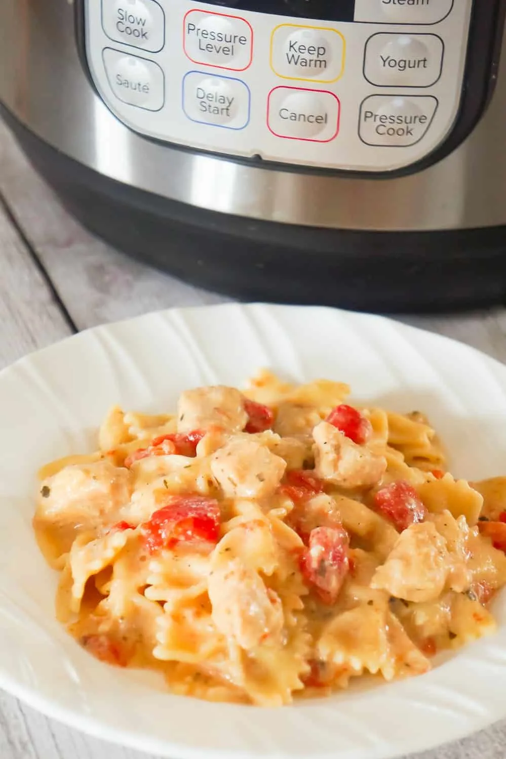 Instant Pot Bruschetta Chicken Pasta is an easy dinner recipe packed with flavour.This easy bow tie pasta recipe is loaded with chicken breast, diced tomatoes, basil pesto and Parmesan cheese.