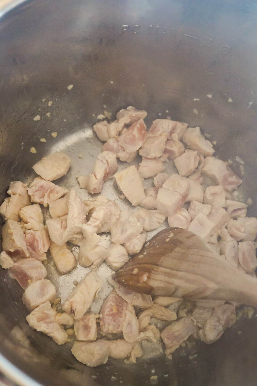 chicken breast chunks cooking in an Instant Pot