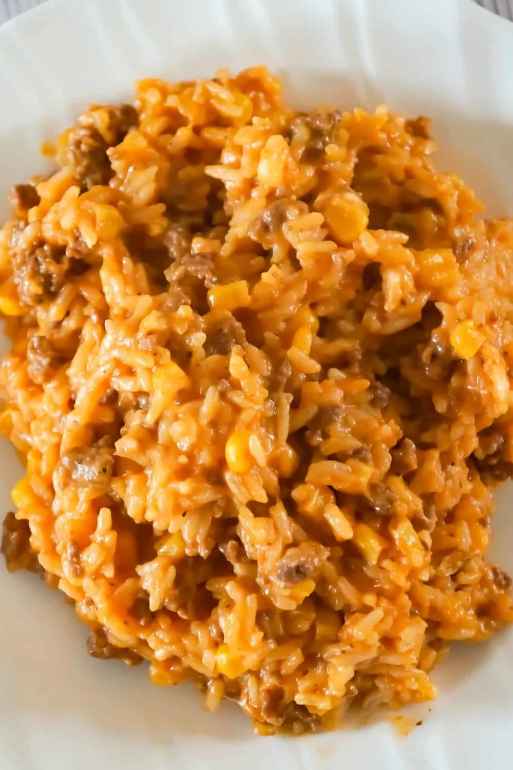 Instant Pot Cheesy Ground Beef and Rice is an easy dinner recipe perfect for weeknights. This Instant Pot rice dish is loaded with ground beef, corn, mozzarella and cheddar cheese.