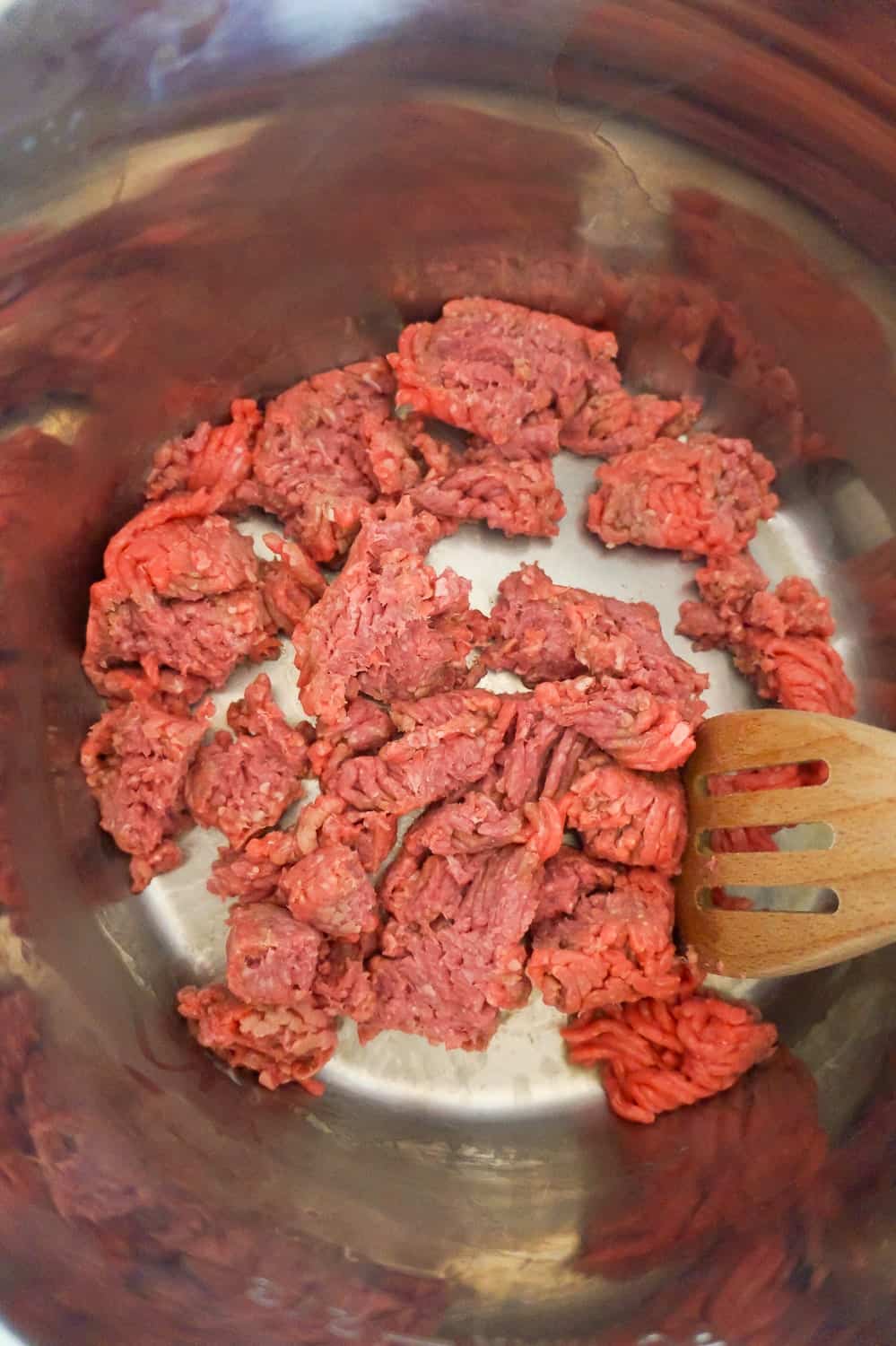 crumbled ground beef cooking in an Instant Pot