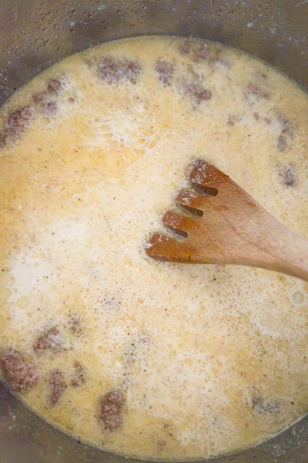 corn, condensed tomato soup and ground beef in milk in an Instant Pot