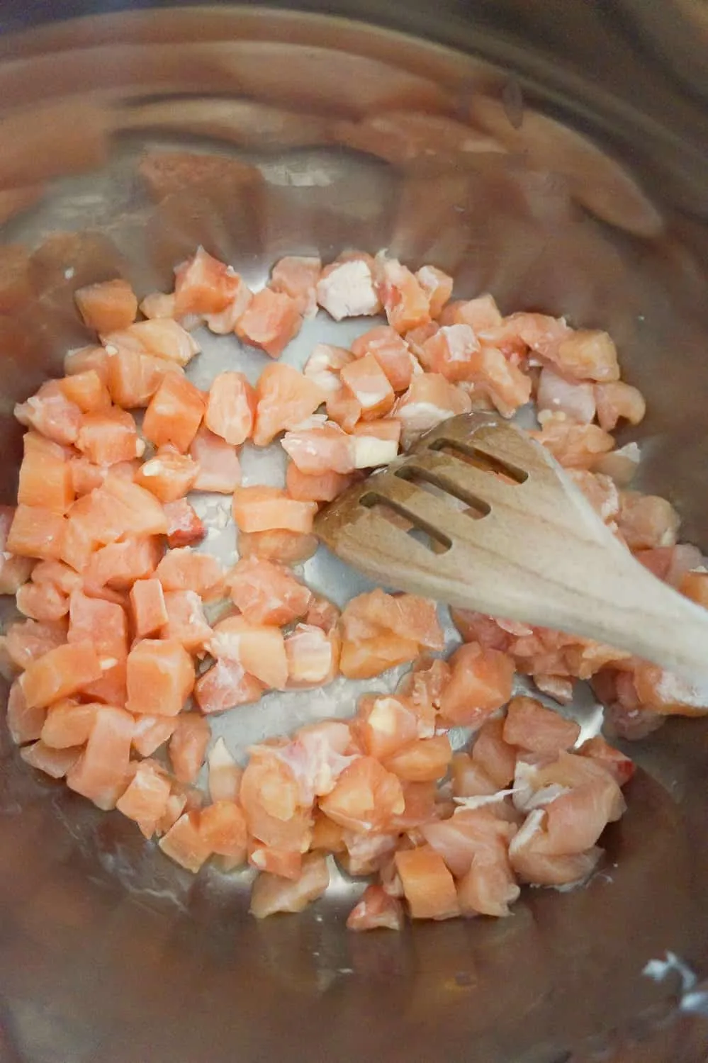 small chunks of raw chicken breast in an Instant Pot