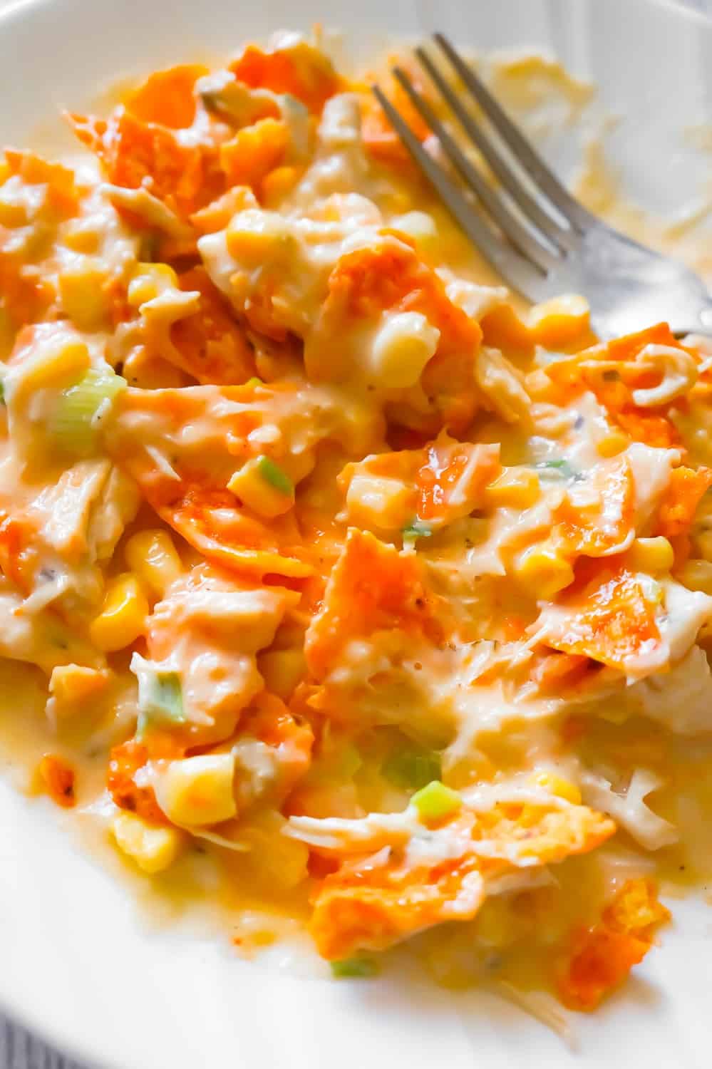 Instant Pot Doritos Chicken Casserole is an easy chicken dinner recipe the whole family will love. This creamy chicken casserole is loaded with corn, green onions, cream cheese, mozzarella and cheddar cheese.