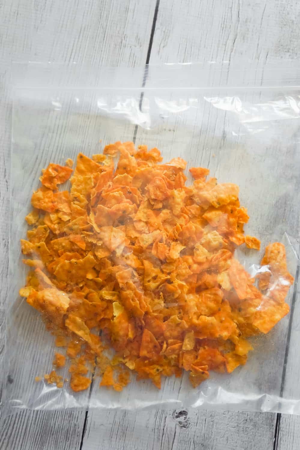 crumbled Doritos in a large Ziploc bag