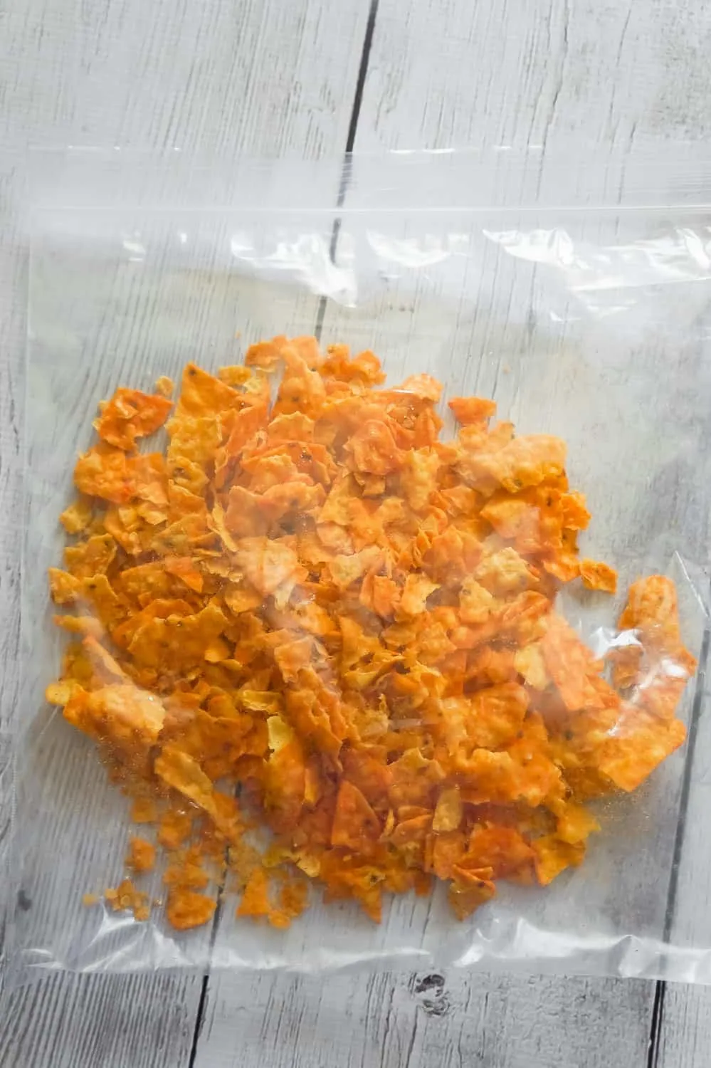 crumbled Doritos in a large Ziploc bag