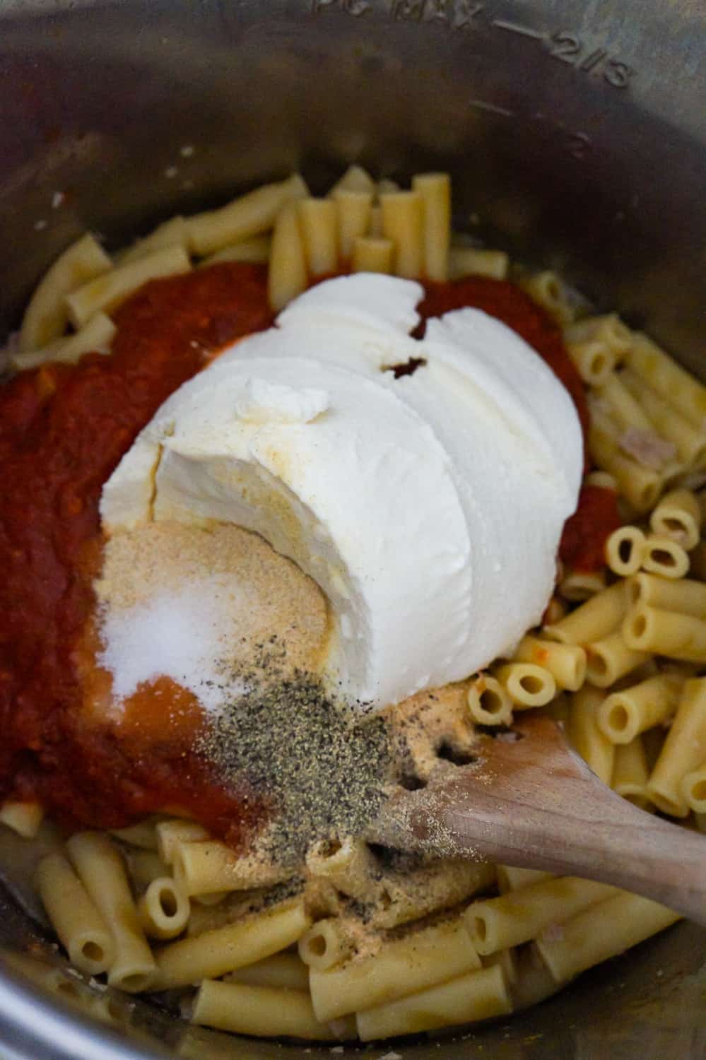 ricotta and marinara on top of cooked ziti in an Instant Pot