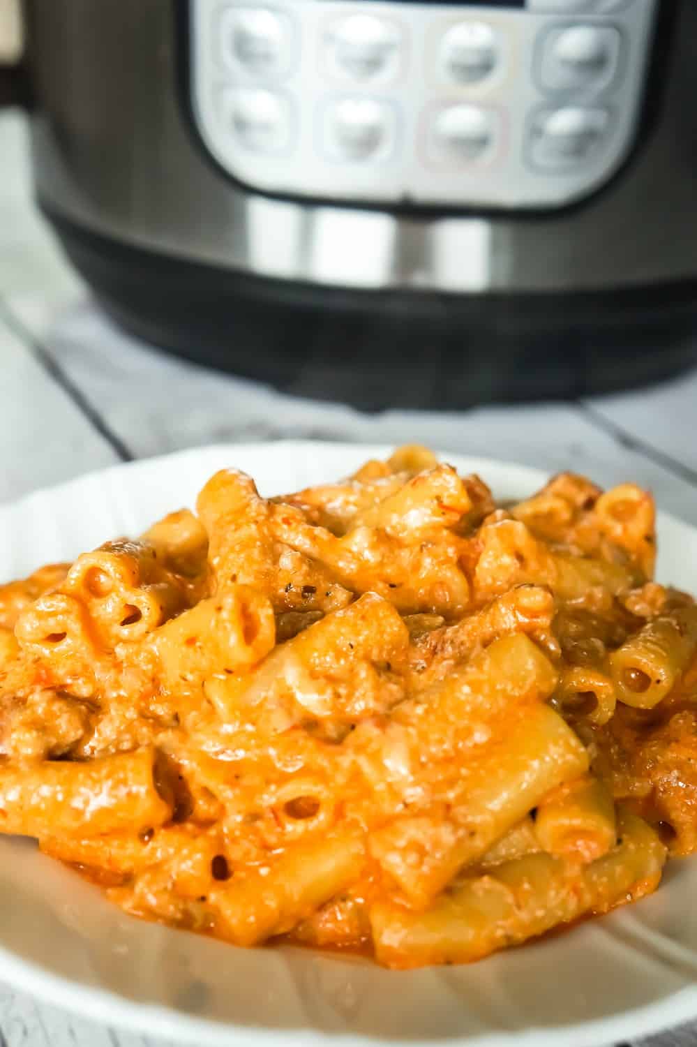 Instant Pot Ziti with Sausage and Ricotta is an easy Instant Pot pasta recipe. This delicious pasta is tossed in a combination of marinara and ricotta and loaded with ground sausage meat and mozzarella cheese.