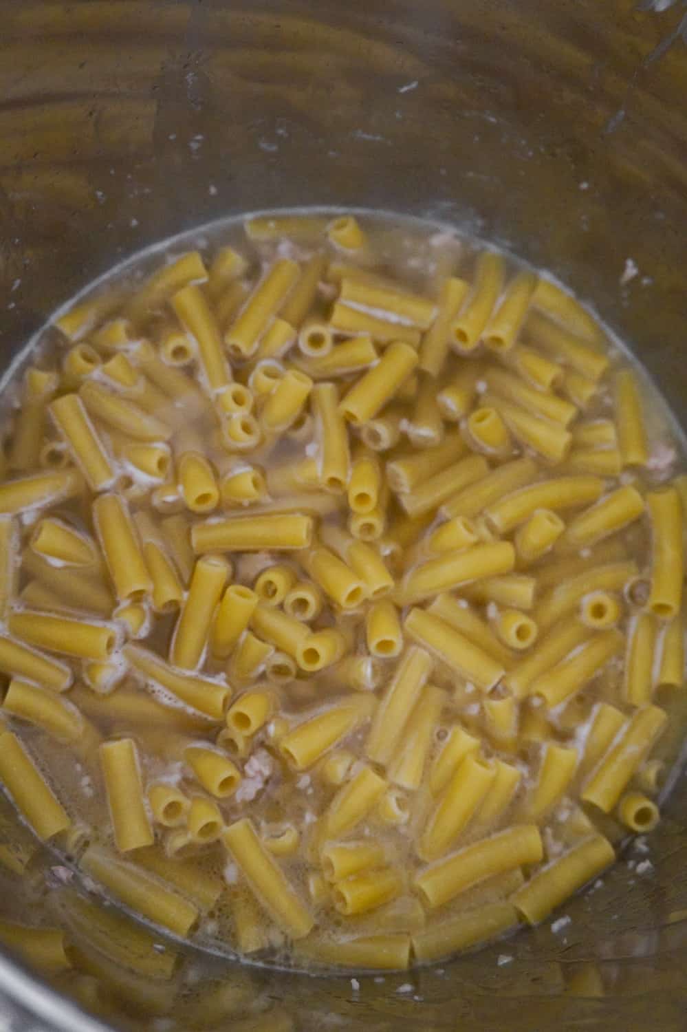uncooked ziti in broth in an Instant Pot