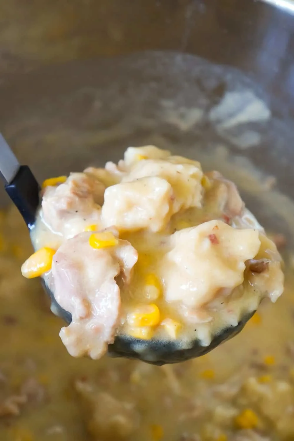 Instant Pot Chicken and Dumplings is an easy dinner recipe using boneless, skinless chicken thighs. This chicken and dumpling recipe uses Pillsbury refrigerated biscuit dough and is loaded with cheese and bacon.