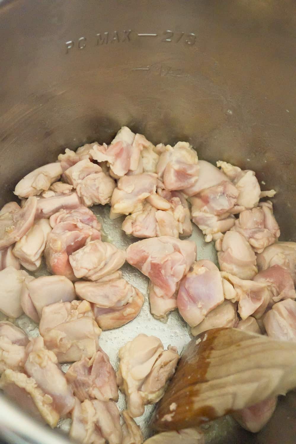 cubed chicken cooking in an Instant Pot