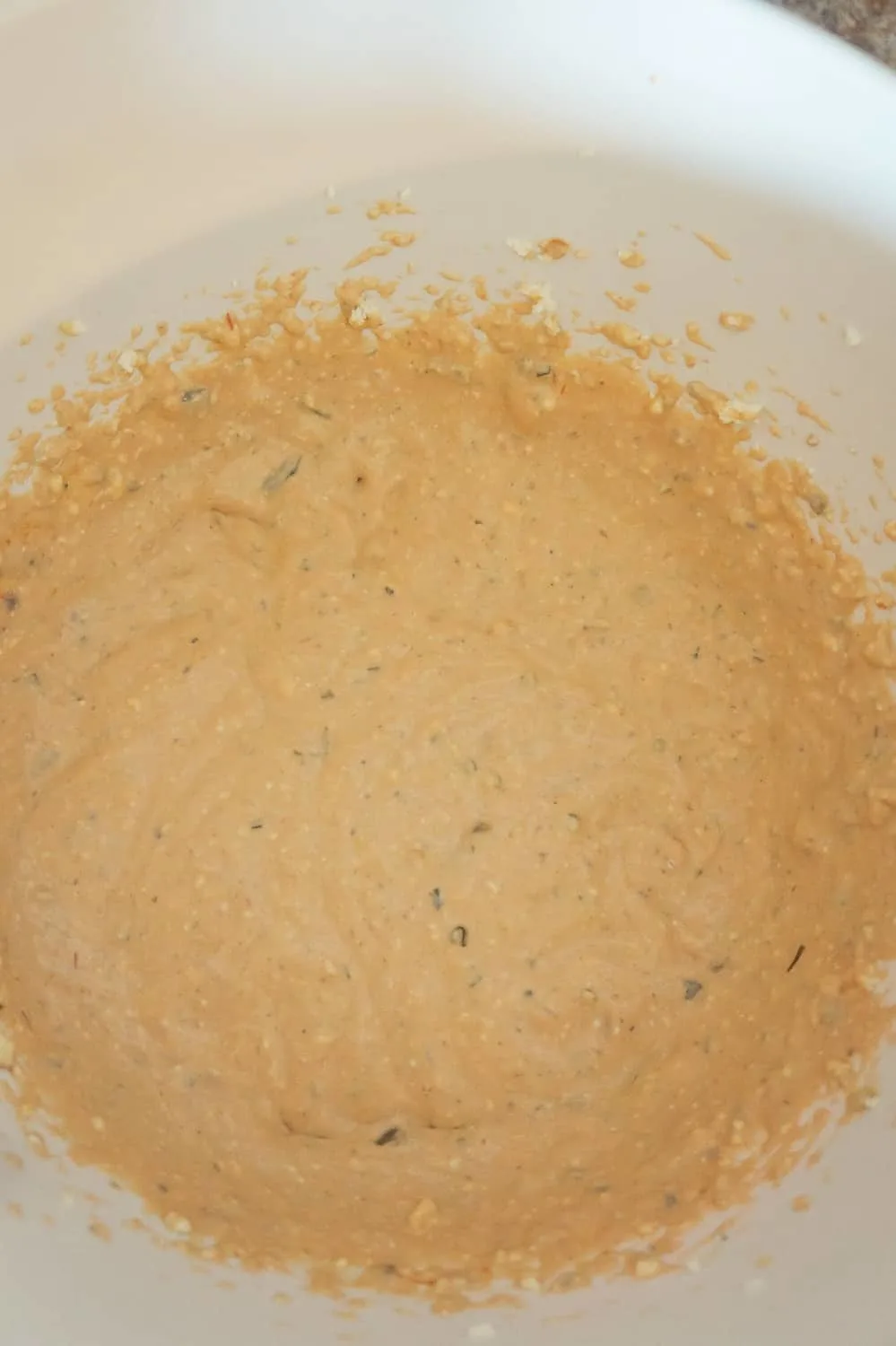 cream cheese and cream of mushroom soup mixture in a mixing bowl