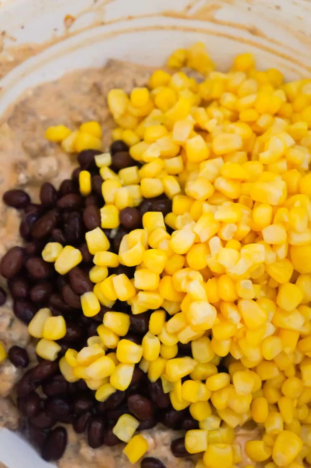 corn and black beans on top of ground beef mixture