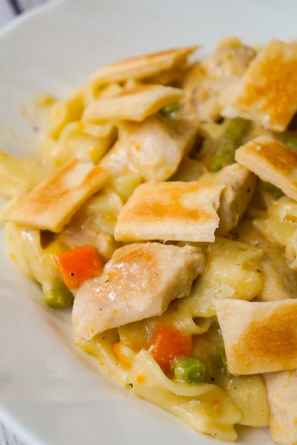 Instant Pot Chicken Pot Pie Pasta is an easy chicken dinner recipe perfect for when you are short on time. This creamy egg noodle pasta is loaded with chicken breast, veggies and topped with strips of Pillsbury pie crust.