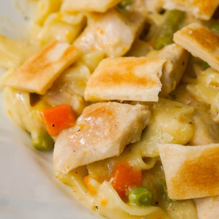 Instant Pot Chicken Pot Pie Pasta is an easy chicken dinner recipe perfect for when you are short on time. This creamy egg noodle pasta is loaded with chicken breast, veggies and topped with strips of Pillsbury pie crust.