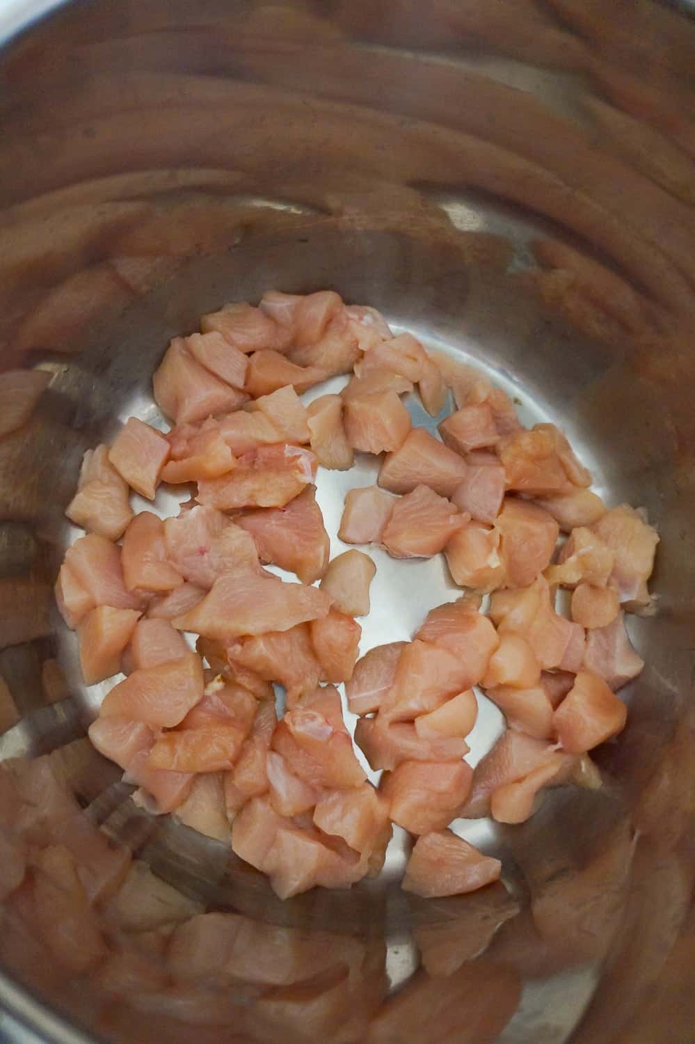 raw chicken breast chunks in an Instant Pot