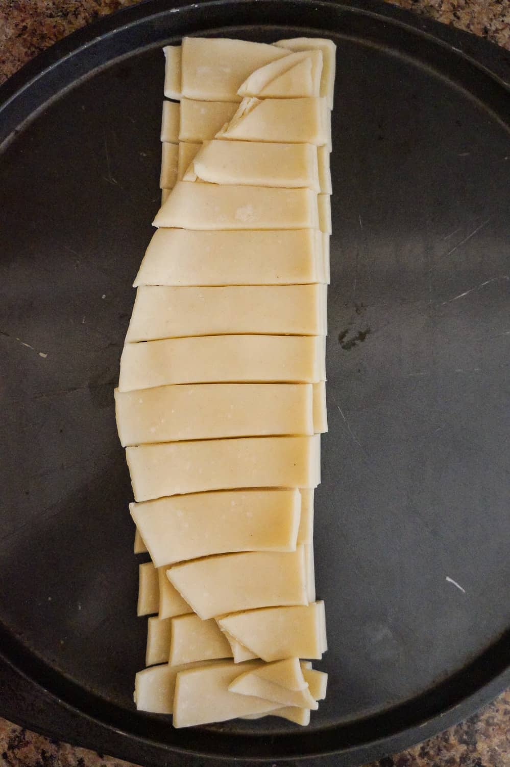 Pillsbury pie crust dough cut into strips