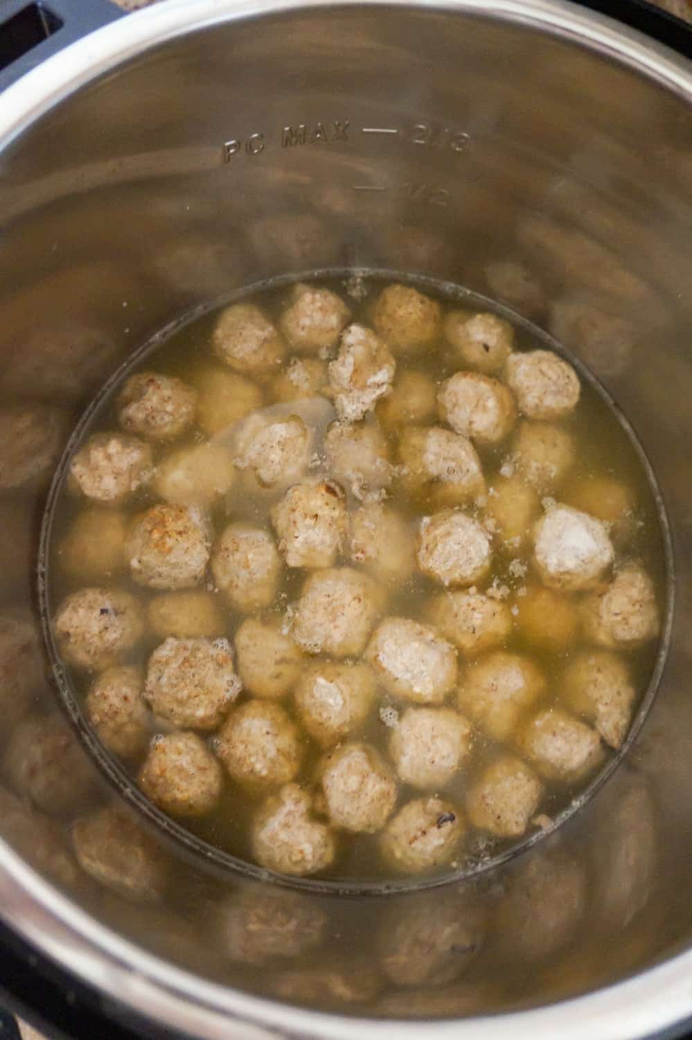 meatballs in water and broth in an Instant Pot