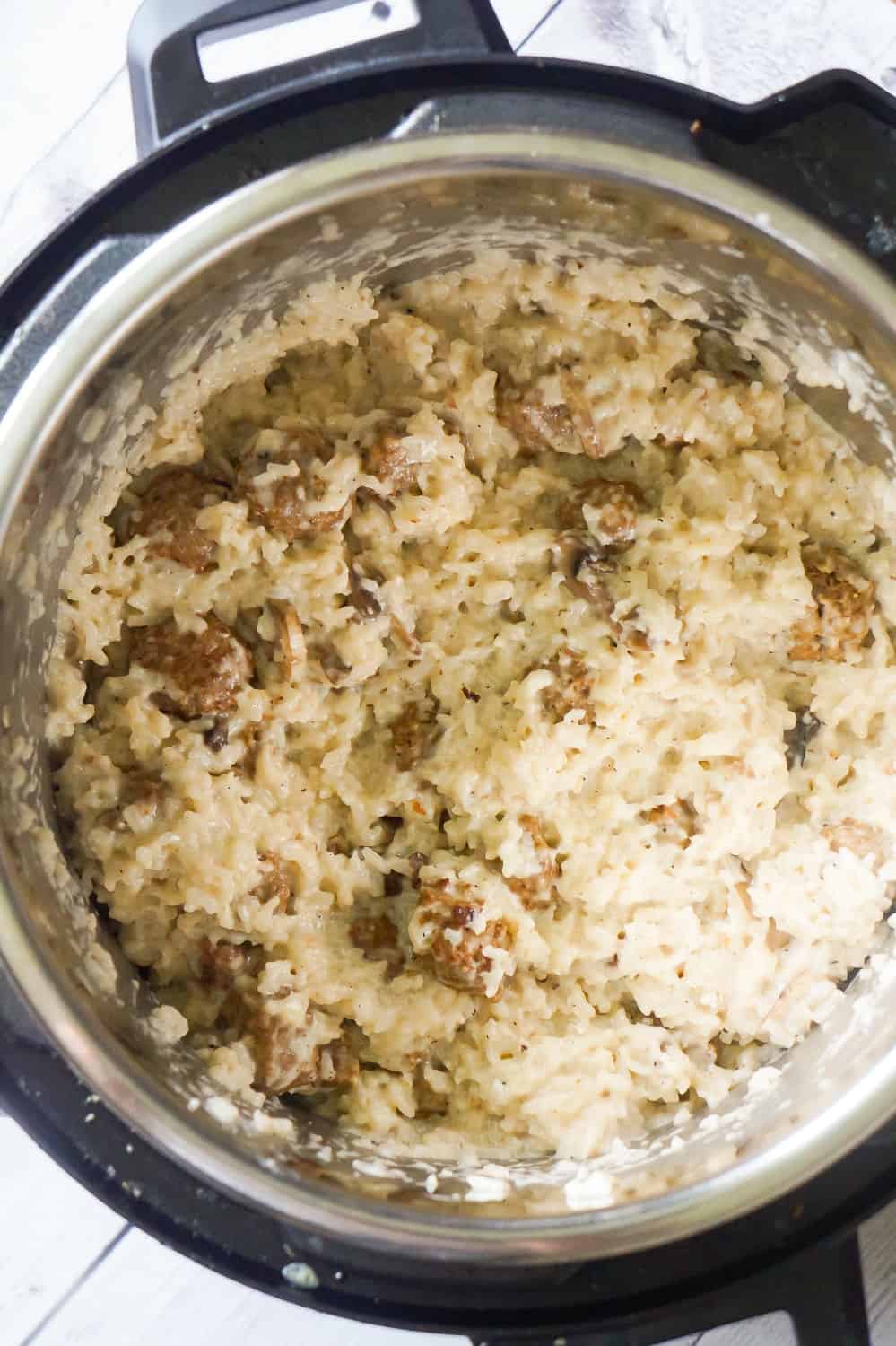 Instant Pot Creamy Mushroom Meatballs and Rice is an easy dinner recipe perfect for weeknights. This hearty dish is loaded with meatballs, long grain white rice and sliced mushrooms.