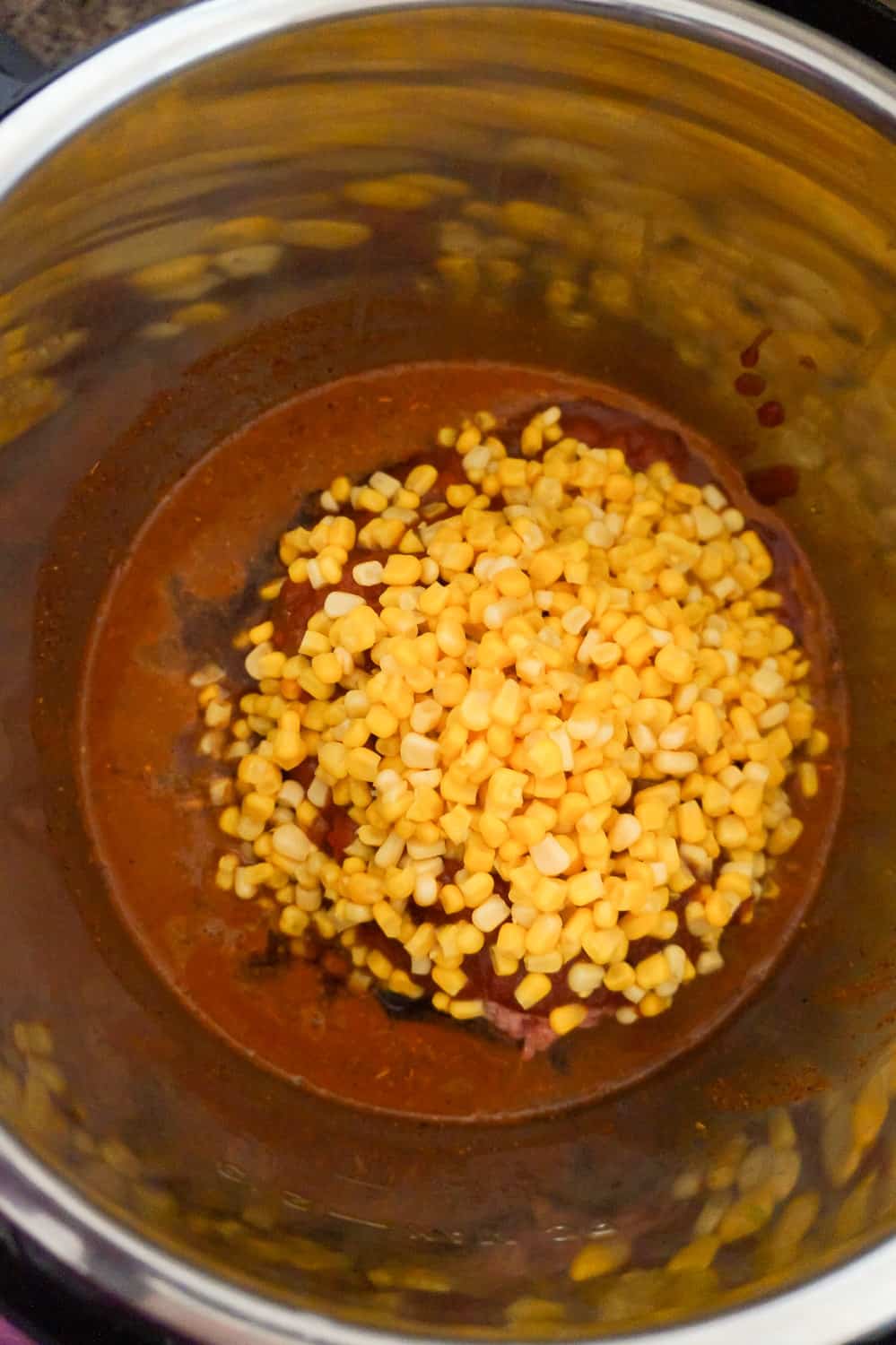 corn, chili sauce and salsa in an Instant Pot