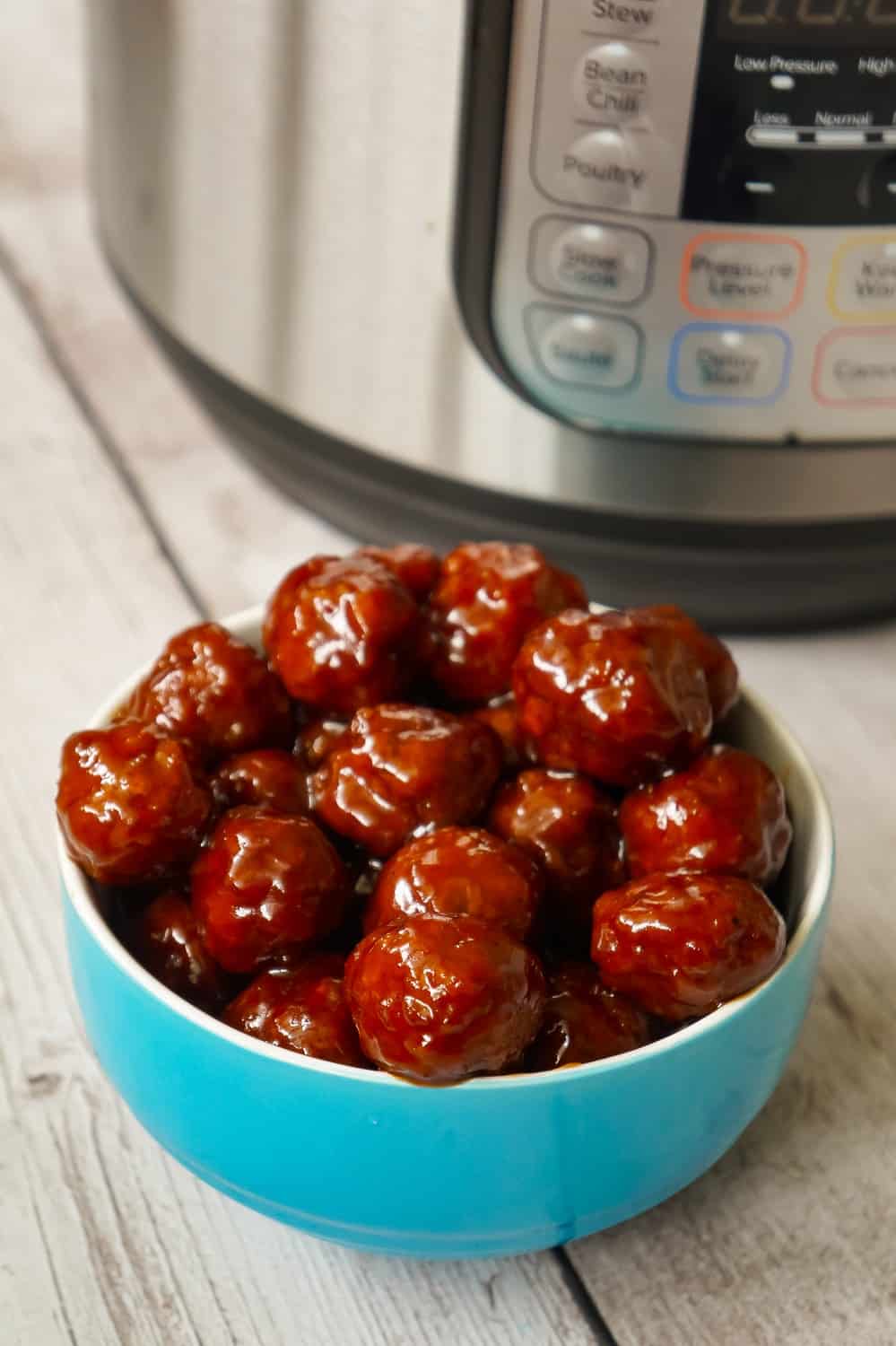 Instant Pot Grape Jelly Meatballs are the perfect party food. These tasty meatballs are coated in Welsh's Grape Jelly and Sweet Baby Ray's Hickory and Brown Sugar BBQ Sauce.