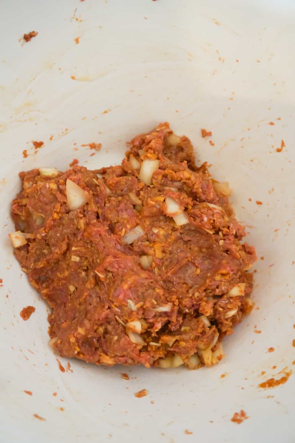 raw meatloaf mixture in a mixing bowl
