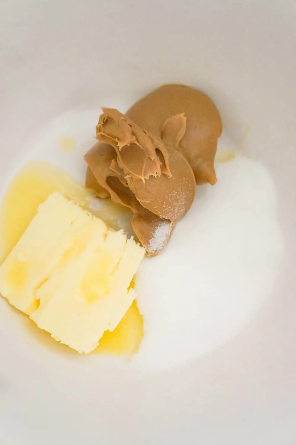 softened butter, smooth peanut butter and granulated sugar in a mixing bowl