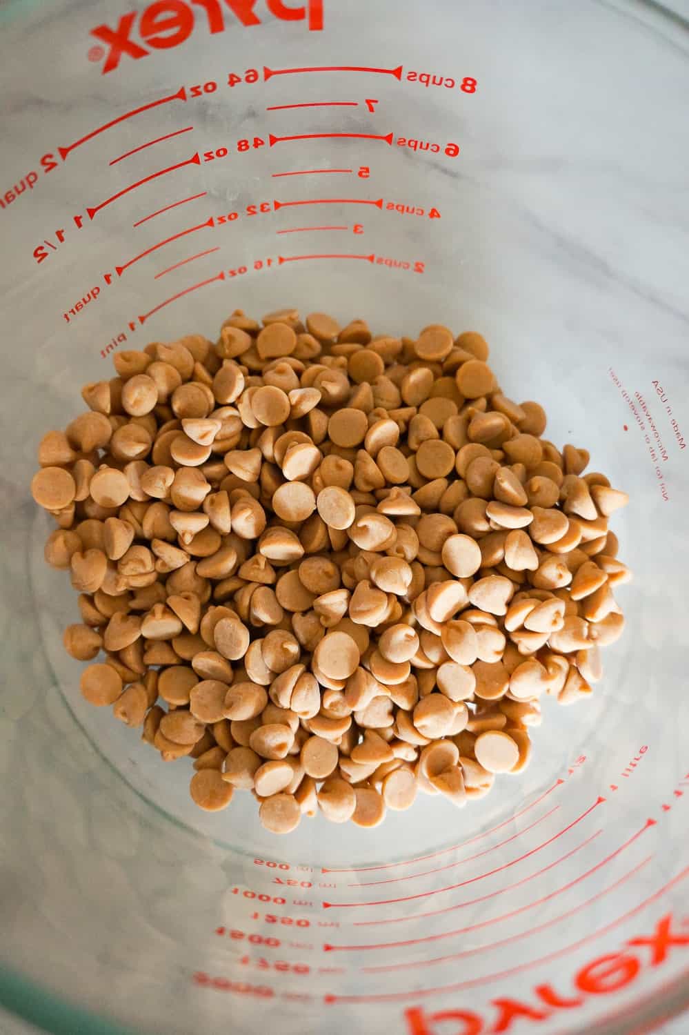 peanut butter baking chips in a glass bowl