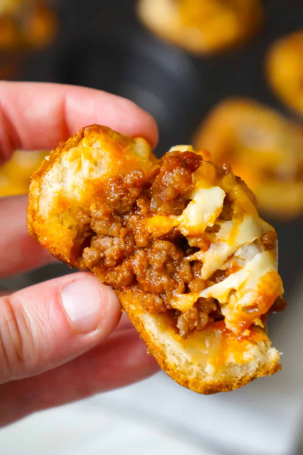 Sloppy Joe Cups are an easy recipe perfect for a fun weeknight dinner or to serve at a party. These hamburger bun cups are filled with ground beef tossed in homemade sloppy joe sauce.