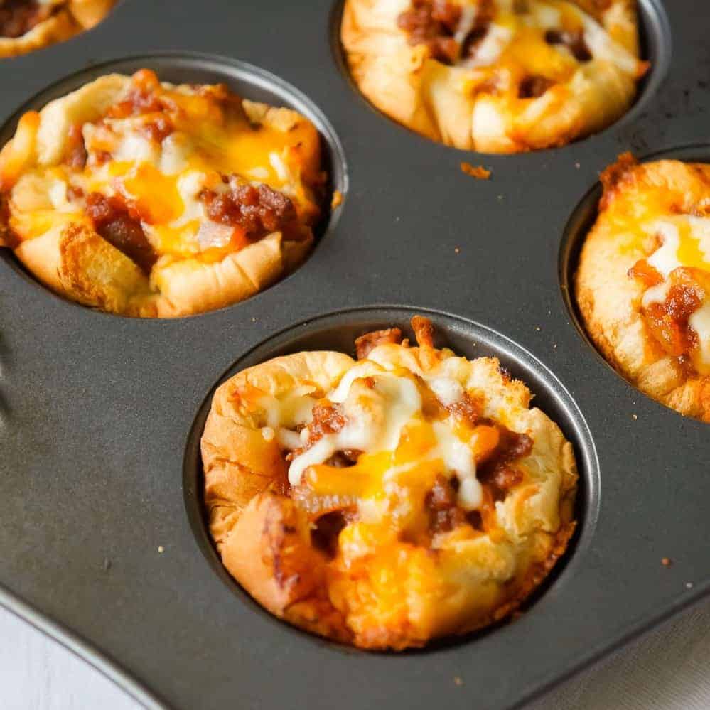 Sloppy Joe Cups are an easy recipe perfect for a fun weeknight dinner or to serve at a party. These hamburger bun cups are filled with ground beef tossed in homemade sloppy joe sauce.