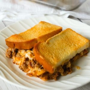 Bacon Cheeseburger Grilled Cheese Casserole is an easy dinner recipe the whole family will love. This delicious casserole is loaded with ground beef, bacon, onions and cheese sandwiched between layers of bread.