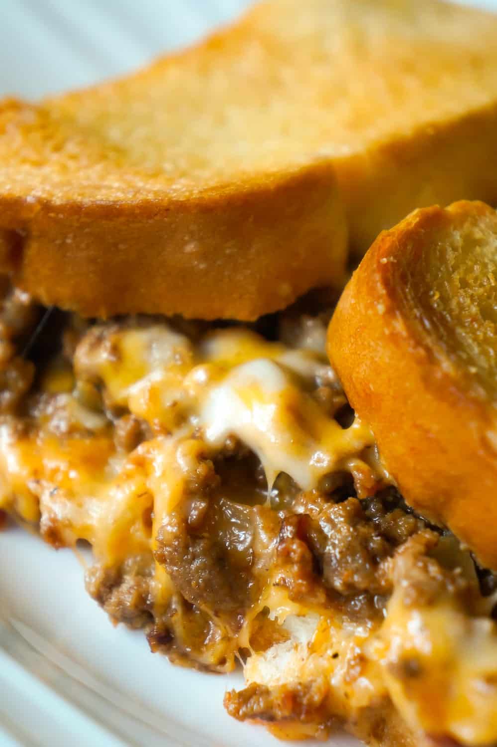 Bacon Cheeseburger Grilled Cheese Casserole is an easy dinner recipe the whole family will love. This delicious casserole is loaded with ground beef, bacon, onions and cheese sandwiched between layers of bread.