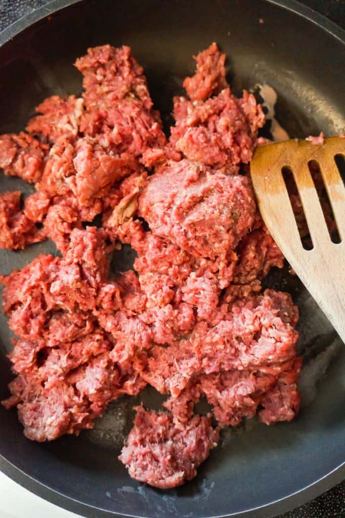 raw ground beef in a frying pan