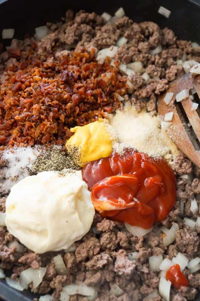 bacon crumble, mayo, ketchup, mustard and spices on top of ground beef mixture