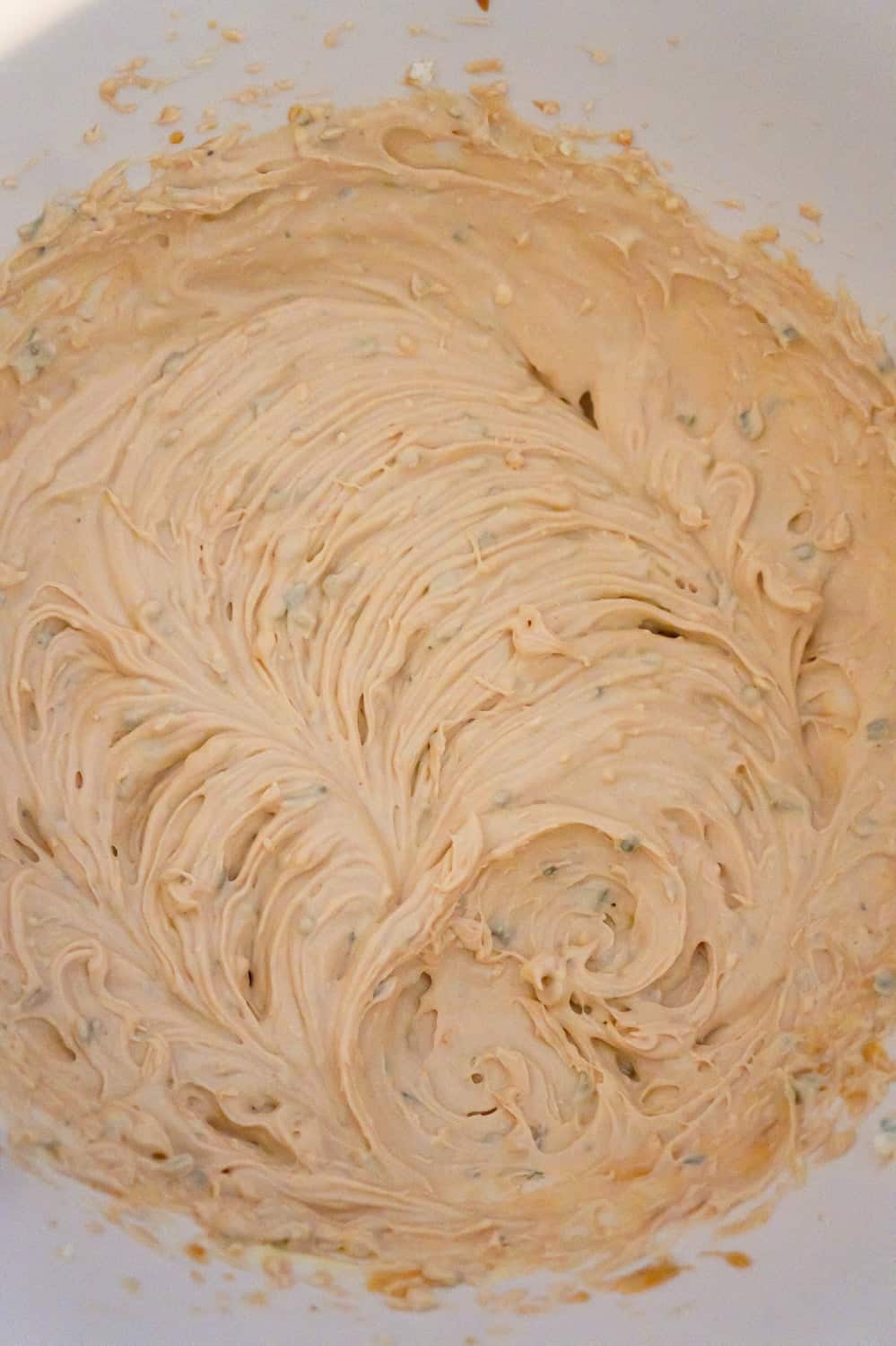 cream cheese and bbq sauce mixture in a mixing bowl