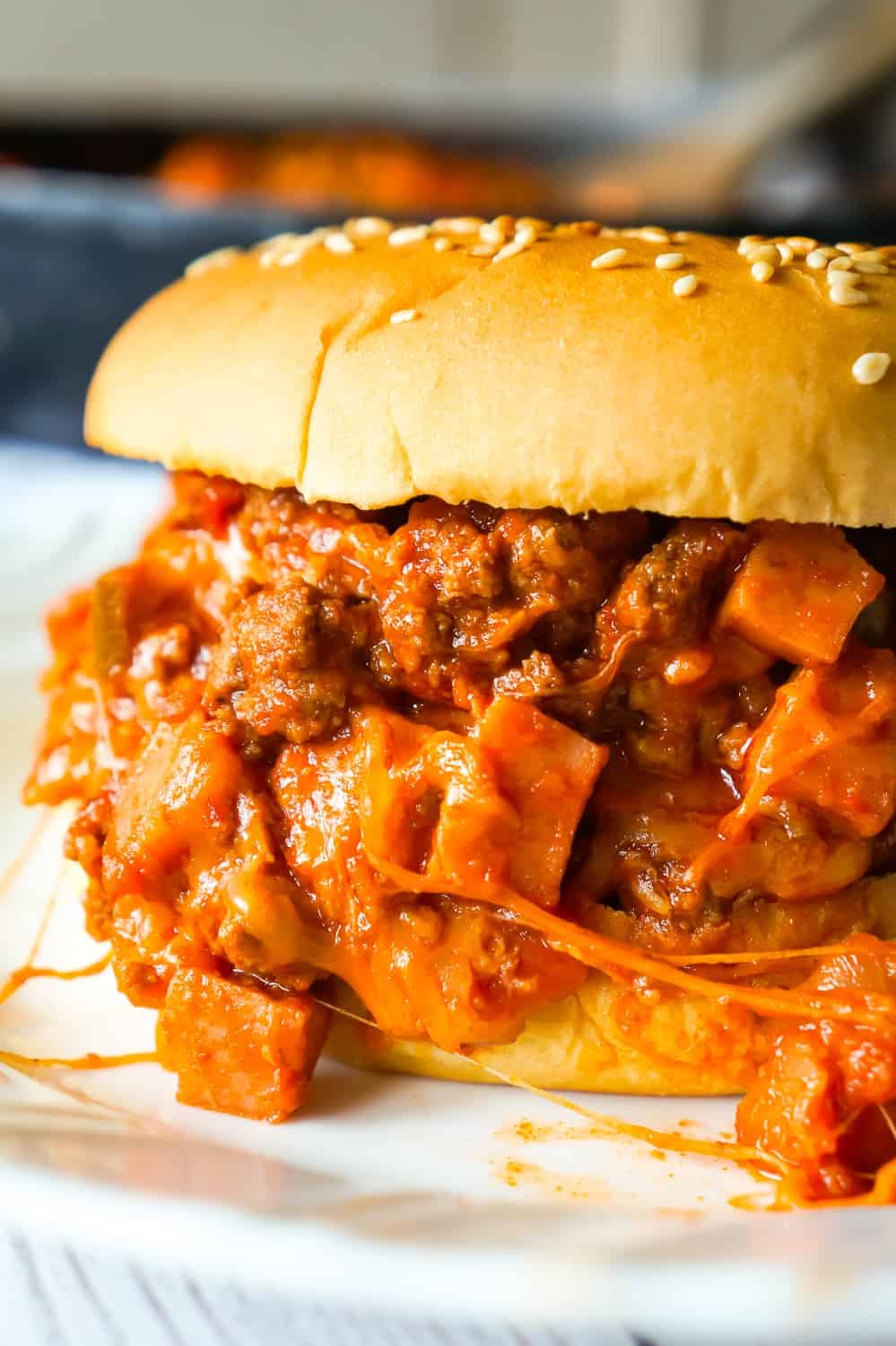 Chili Cheese Dog Sloppy Joes are an easy ground beef dinner recipe perfect for weeknights. These homemade sloppy joes are loaded with chopped wieners, shredded cheese, and onions all tossed in a chili sauce with a bit of a kick.