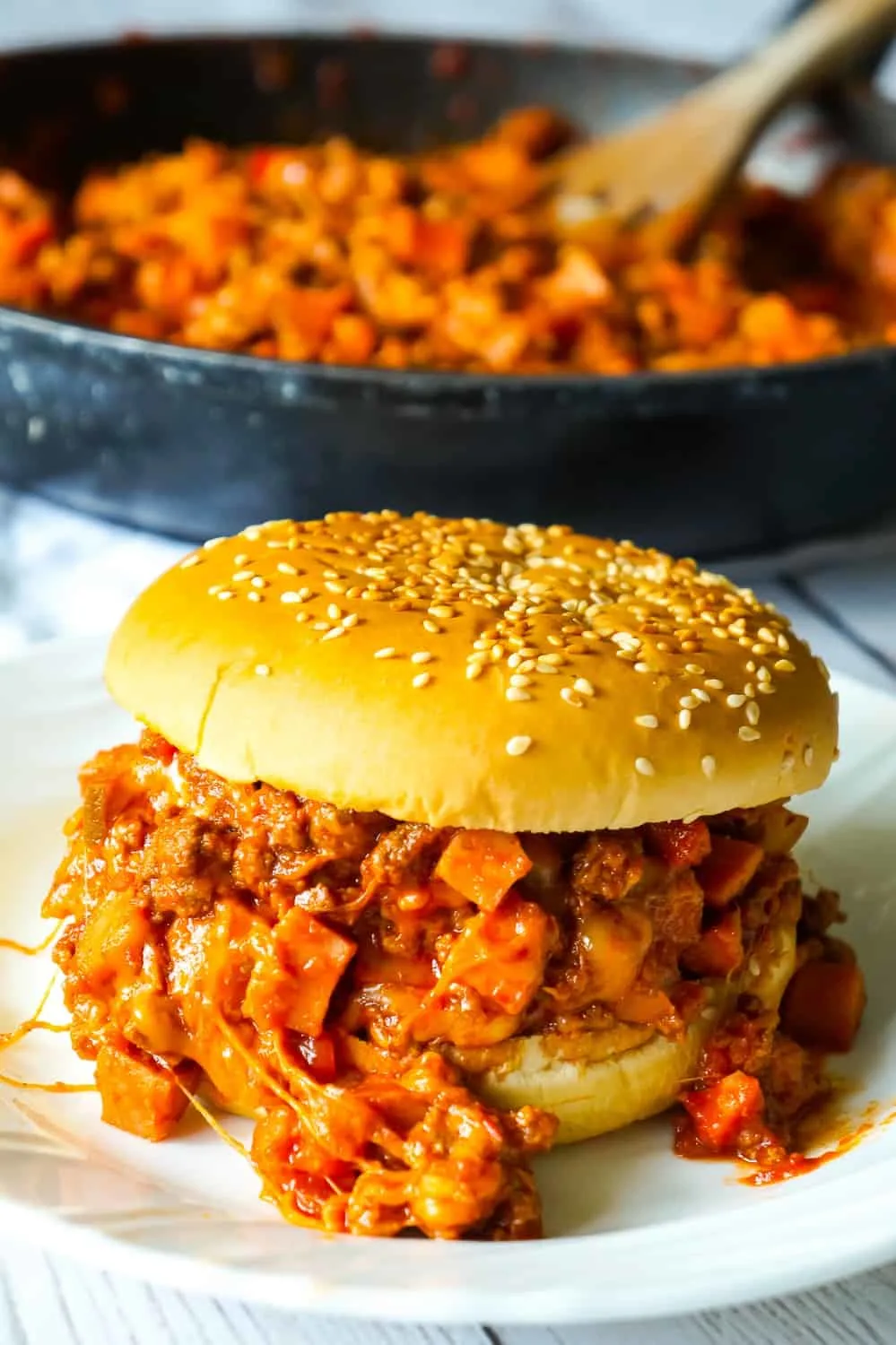 Chili Cheese Dog Sloppy Joes are an easy ground beef dinner recipe perfect for weeknights. These homemade sloppy joes are loaded with chopped wieners, shredded cheese, and onions all tossed in a chili sauce with a bit of a kick.
