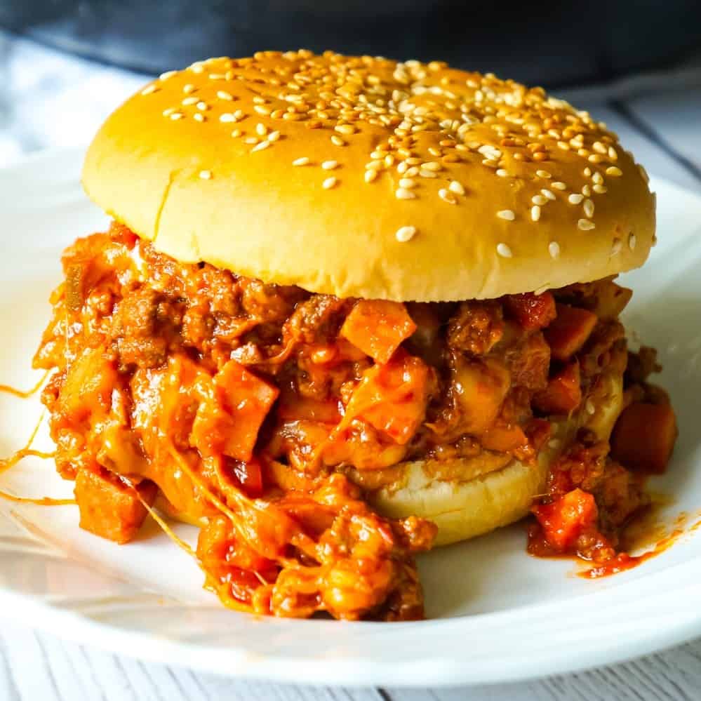 Chili Cheese Dog Sloppy Joes are an easy ground beef dinner recipe perfect for weeknights. These homemade sloppy joes are loaded with chopped wieners, shredded cheese, and onions all tossed in a chili sauce with a bit of a kick.