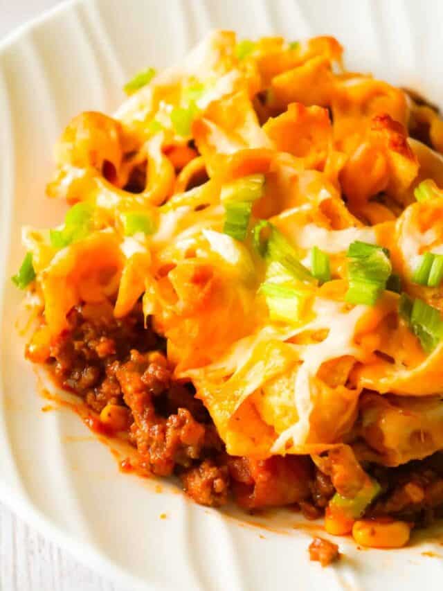 Frito Pie is an easy ground beef dinner recipe the whole family will love. This ground beef casserole starts with a chili base and is topped with Frito's corn chips, shredded cheese and green onions.