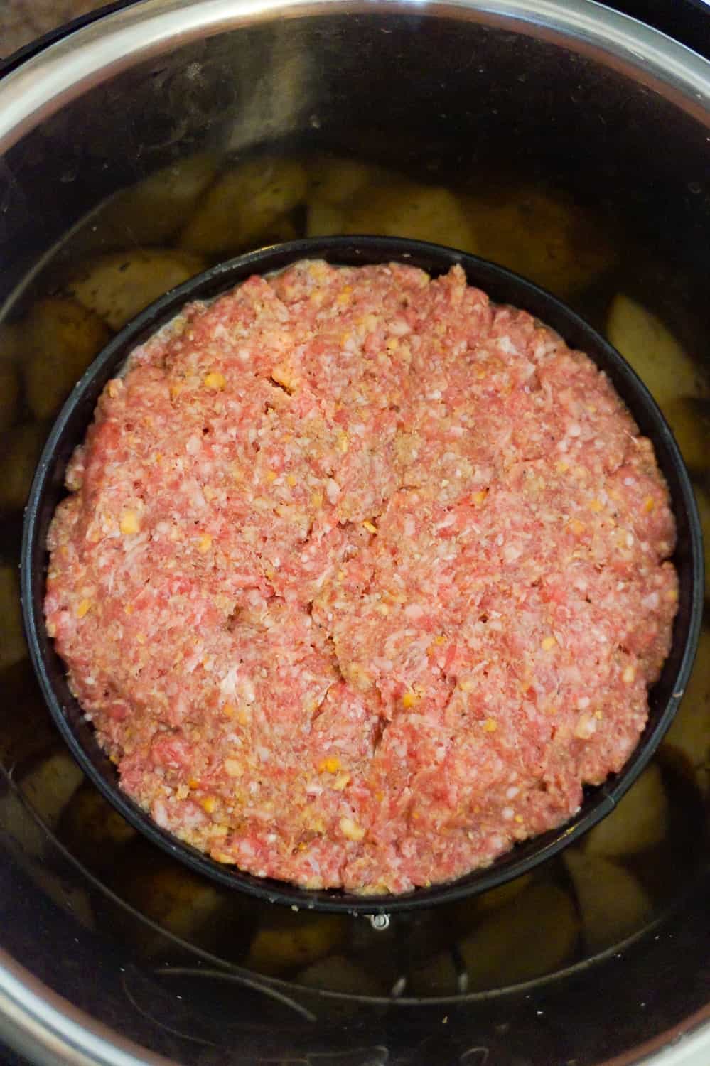 raw meatloaf in a spring form pan in an Instant Pot