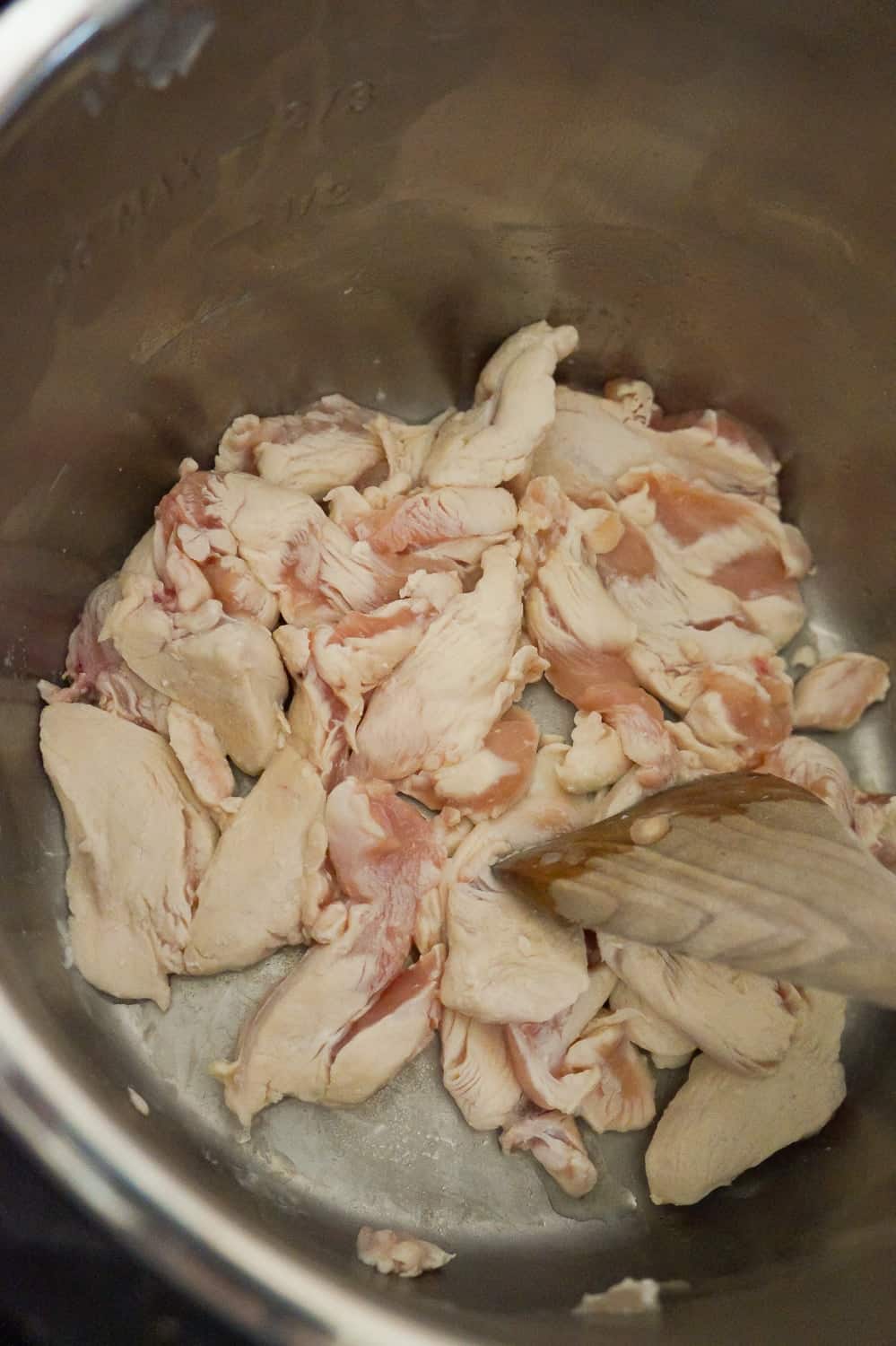 chicken breast strips cooking in an Instant Pot