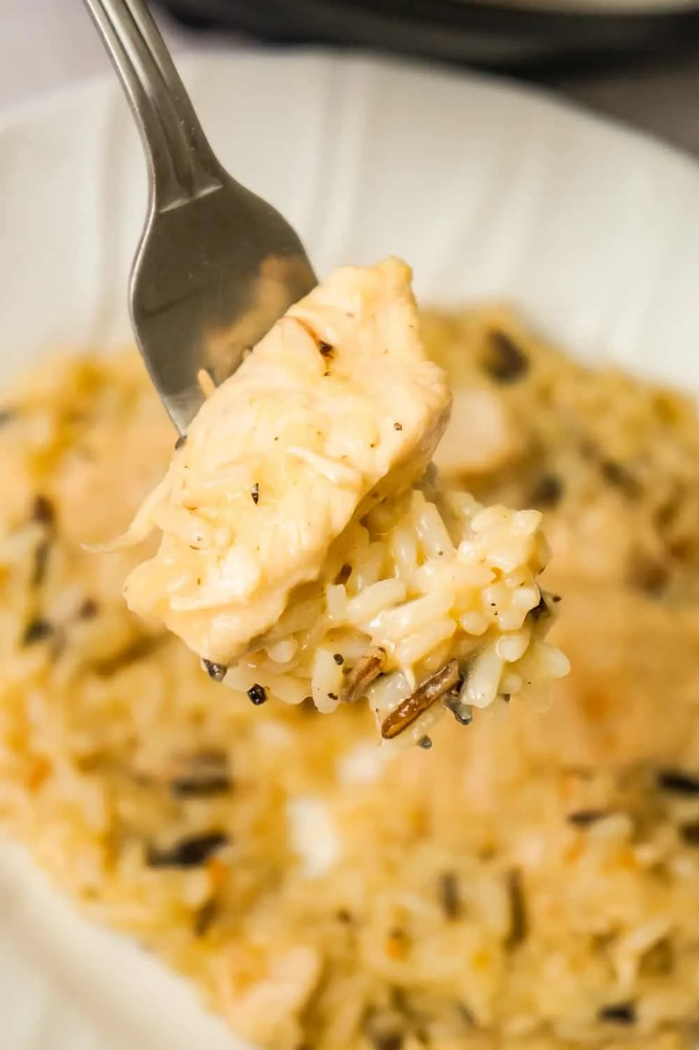 Instant Pot Lemon Pepper Chicken and Rice is an easy and delicious chicken dinner recipe. This creamy long grain and wild rice dish is loaded with tender chicken breast chunks.